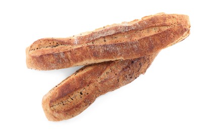 Photo of Tasty buckwheat baguettes on white background, top view. Fresh bread