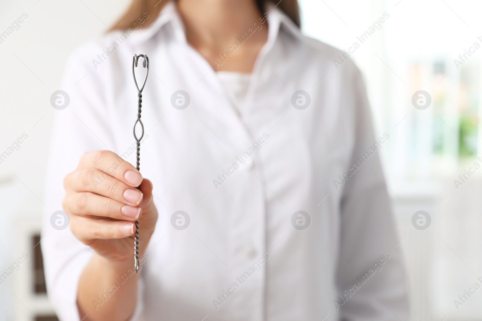 Photo of Speech therapist with logopedic probe in clinic, closeup. Space for text