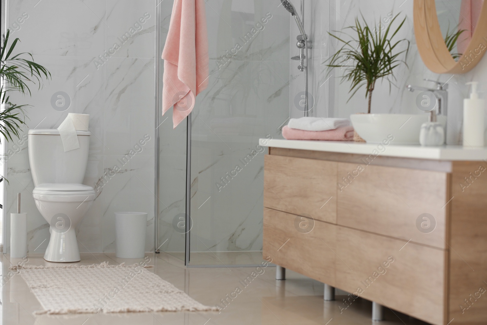 Photo of Interior of modern bathroom with toilet bowl