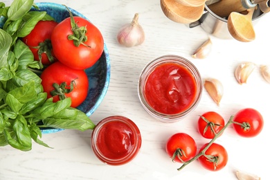 Composition with tasty homemade tomato sauce on table, flat lay