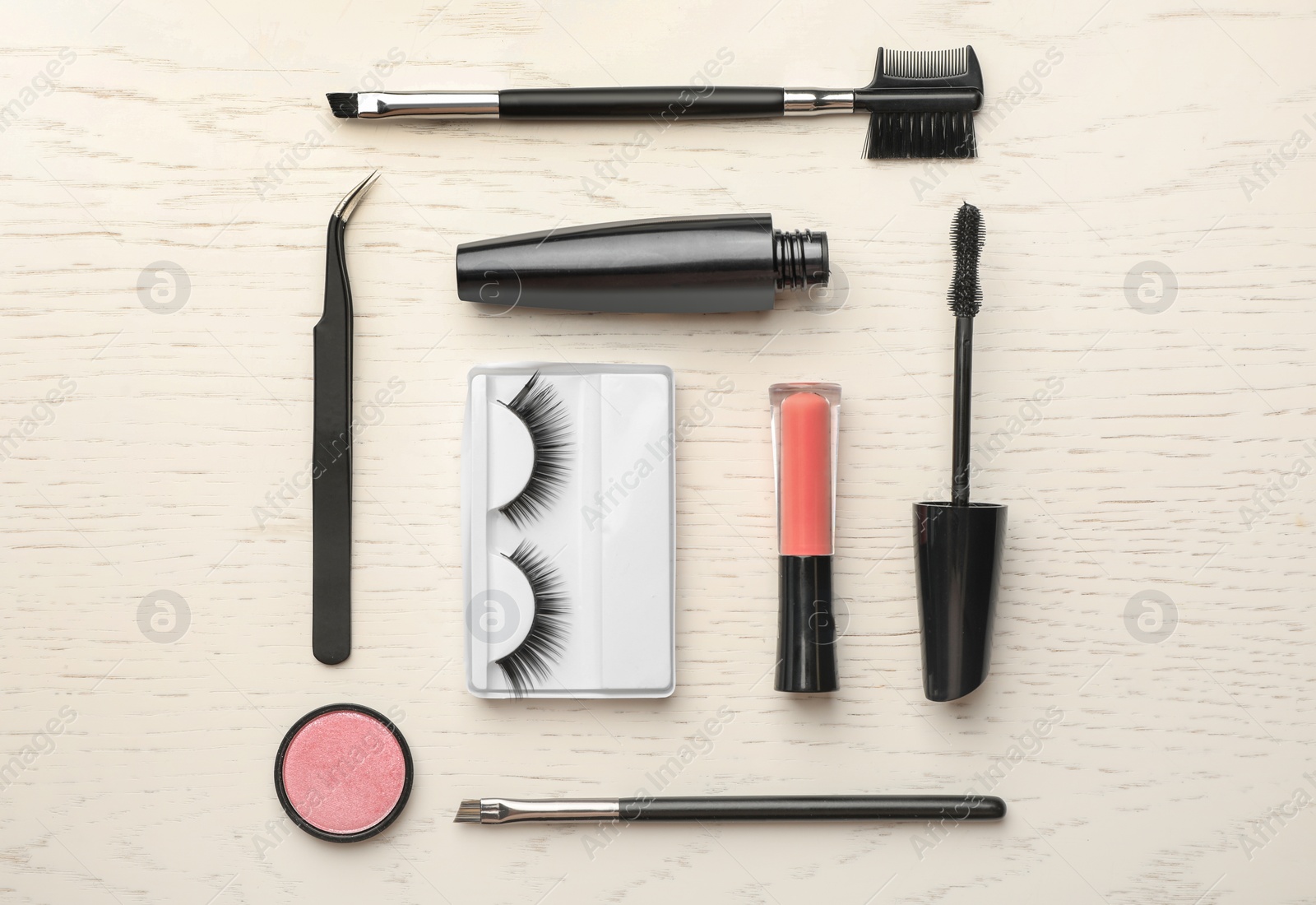 Photo of Flat lay composition with artificial eyelashes and accessories on wooden background