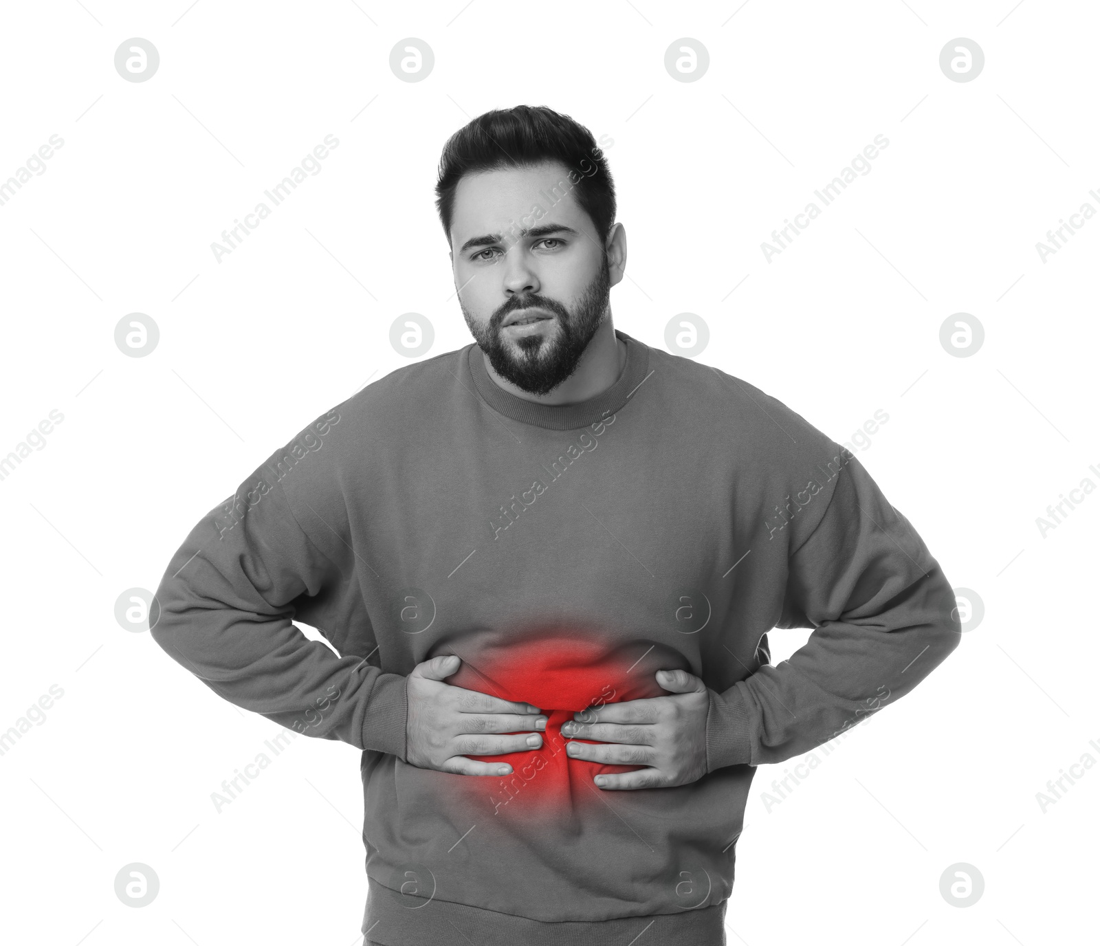 Image of Man suffering from abdominal pain on white background. Black and white effect with red accent