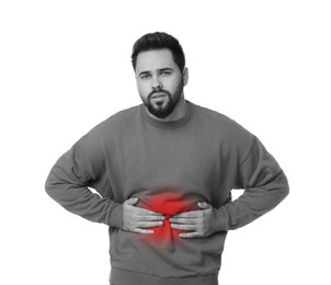 Man suffering from abdominal pain on white background. Black and white effect with red accent