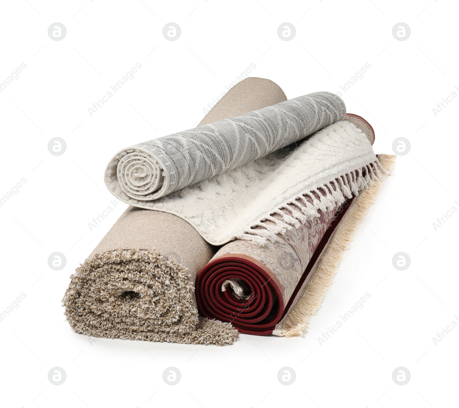 Photo of Rolled carpets on white background. Interior element