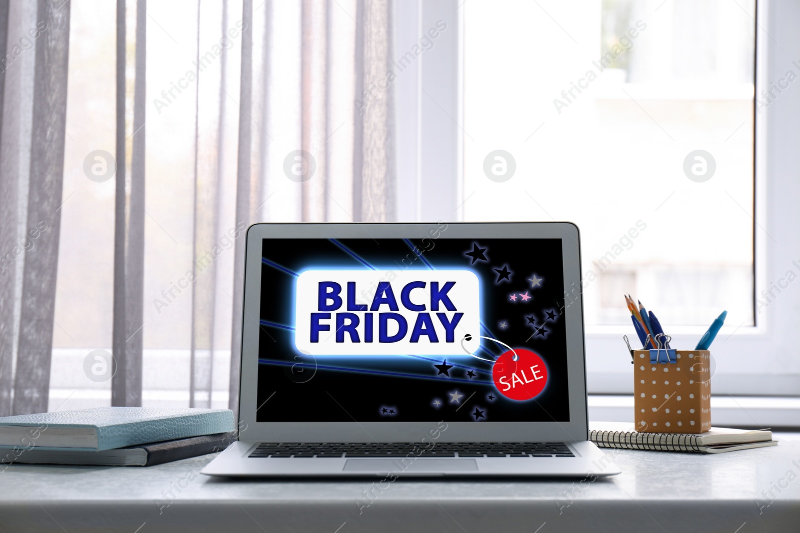 Image of Black Friday announcement on laptop screen. Online shopping