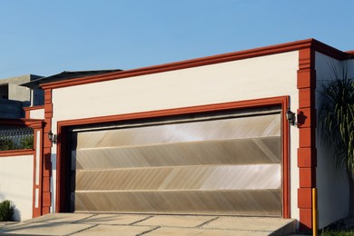 Photo of Garage building with closed sectional metal gate