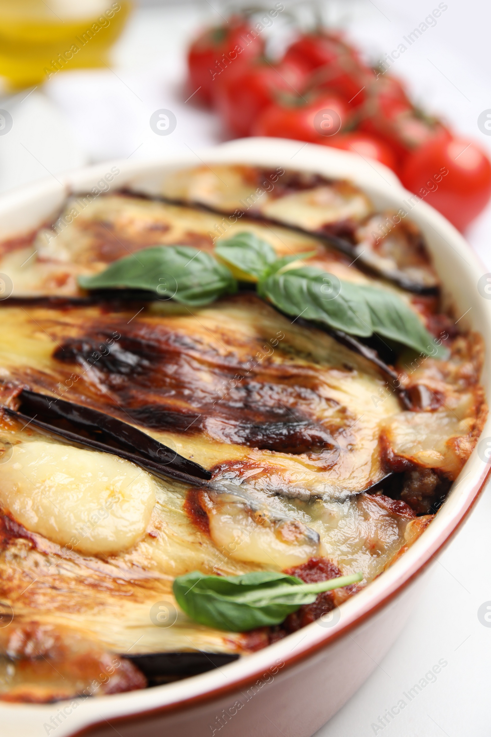 Photo of Delicious eggplant lasagna in baking dish on table, closeup