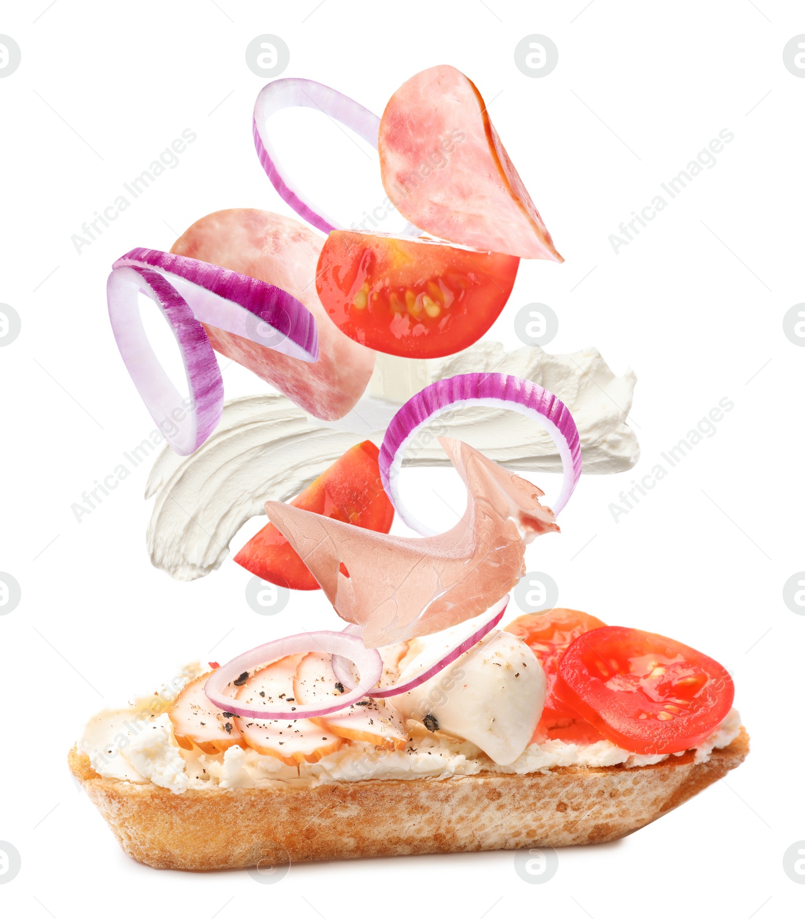 Tasty bruschetta with flying ingredients on white background Image of Tasty bruschetta with flying ingredients on white background