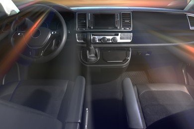 Image of Driver's and passenger's seats in car, motion blur effect