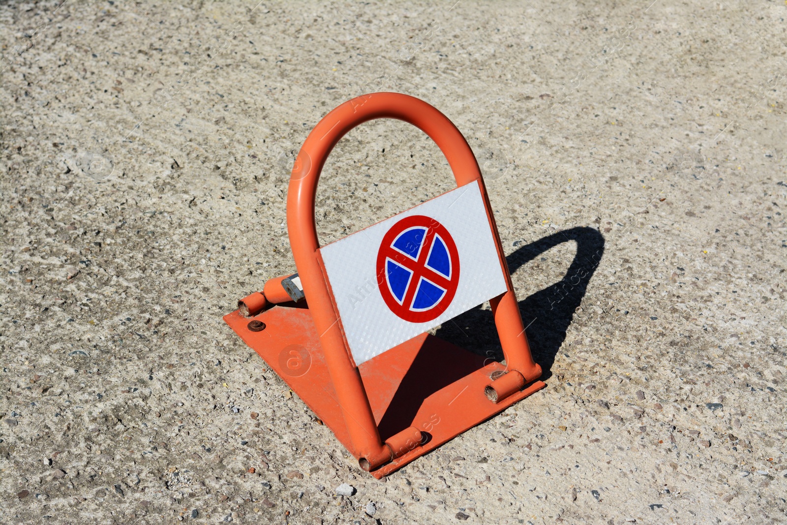 Photo of Parking barrier with No Stopping road sign on it outdoors