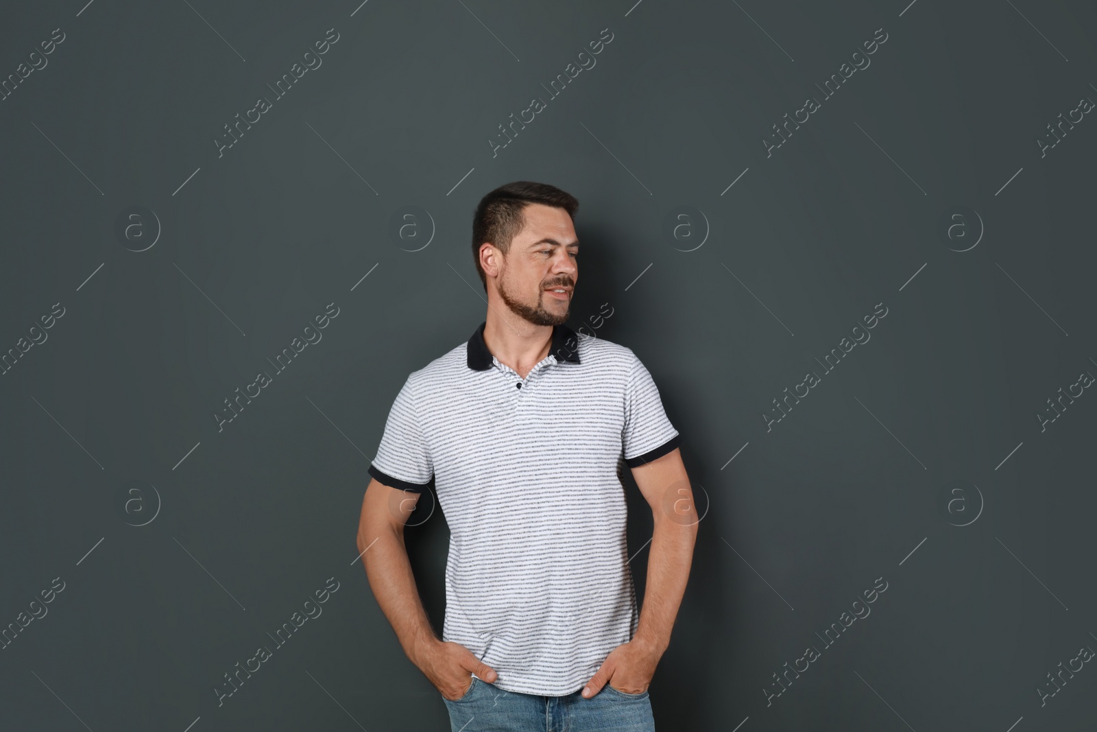 Photo of Portrait of handsome man on dark background