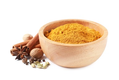 Photo of Dry curry powder in bowl and other spices isolated on white