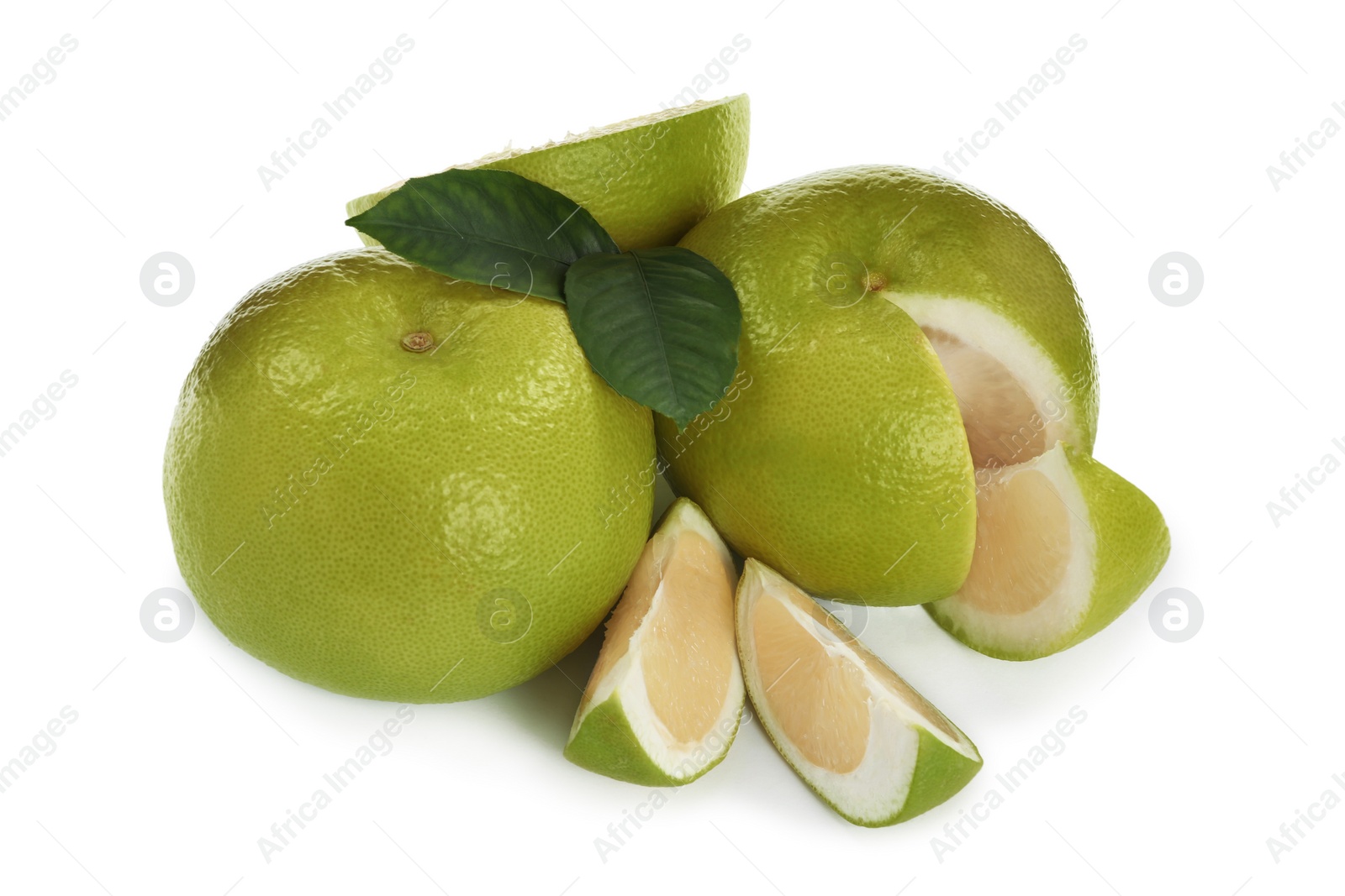 Photo of Whole and cut sweetie fruits with green leaves on white background