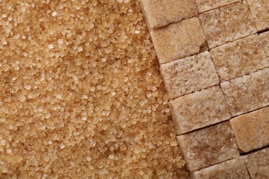 Photo of Different types of brown sugar as background, top view. Space for text