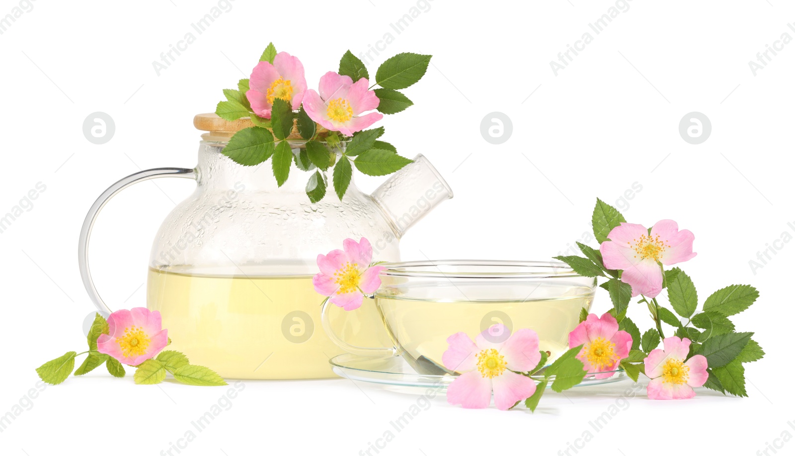 Photo of Aromatic herbal tea with rose hip flowers isolated on white