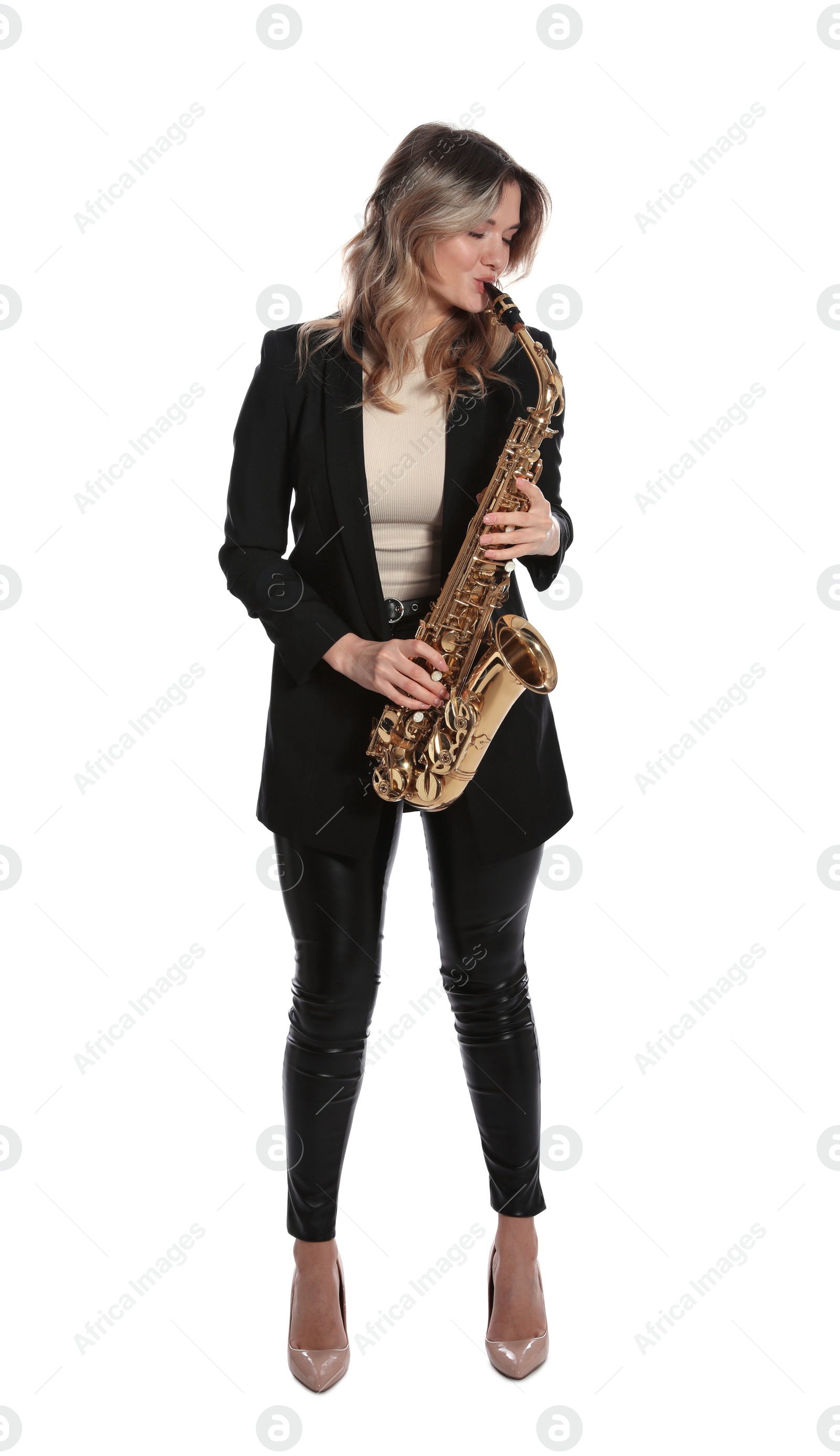 Photo of Beautiful young woman in elegant suit playing saxophone on white background