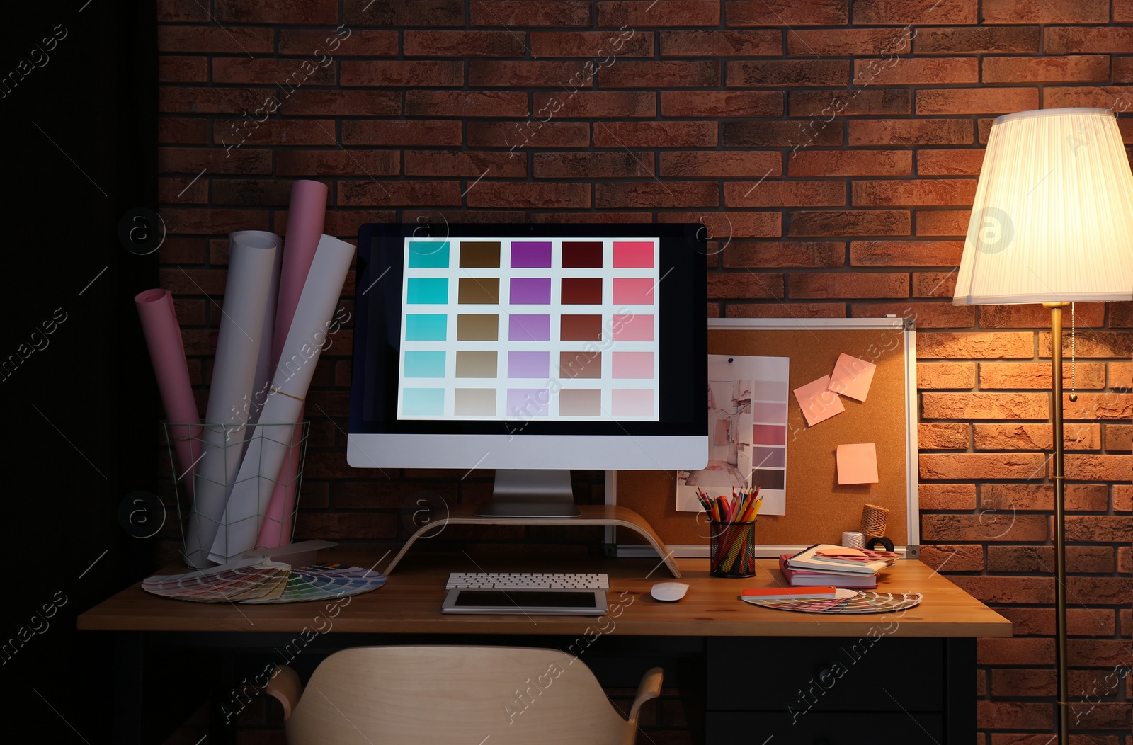 Photo of Modern computer and office supplies on wooden table. Designer's workplace