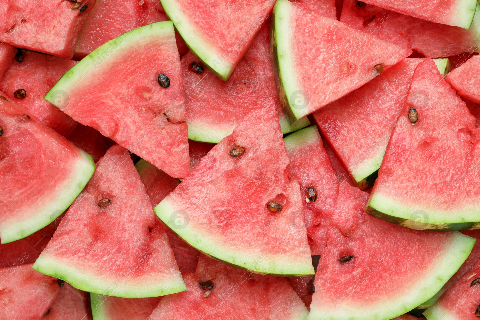 Photo of Slices of tasty ripe watermelon as background, top view