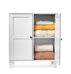 Wooden cabinet with clothes on white background. Stylish furniture for wardrobe room