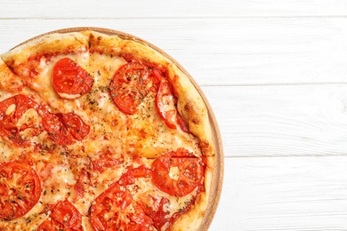 Photo of Hot cheese pizza Margherita on white wooden background, top view. Space for text