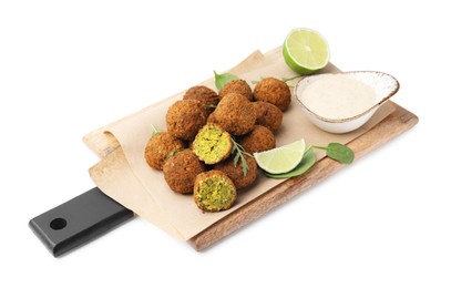 Delicious falafel balls, sauce, herbs and lime isolated on white