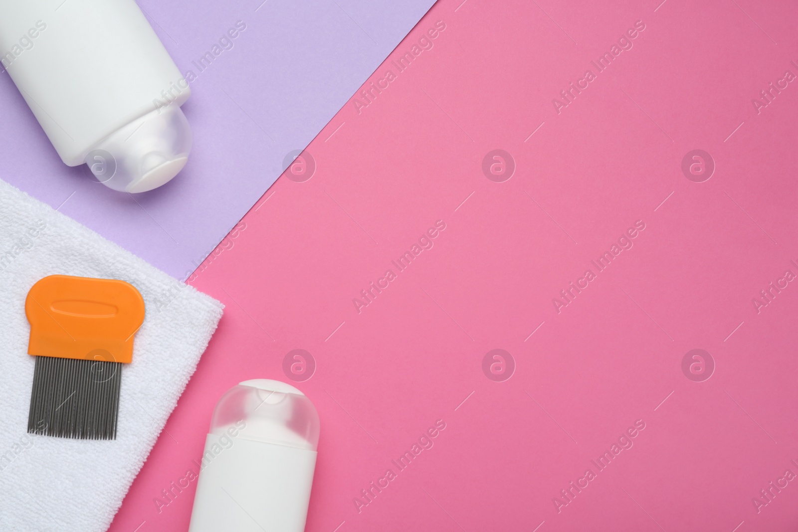 Photo of Anti lice products in bottles, comb and towel on color background, flat lay. Space for text
