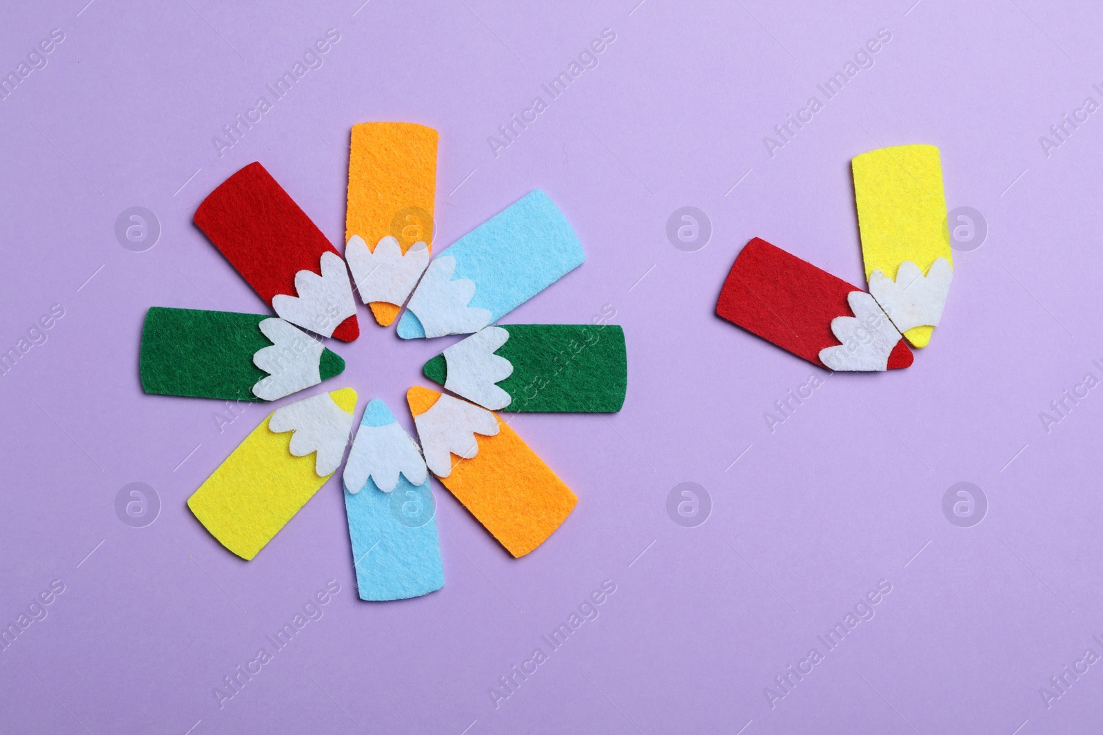 Photo of Flat lay composition with colorful felt pencils on violet background. Pareto principle concept