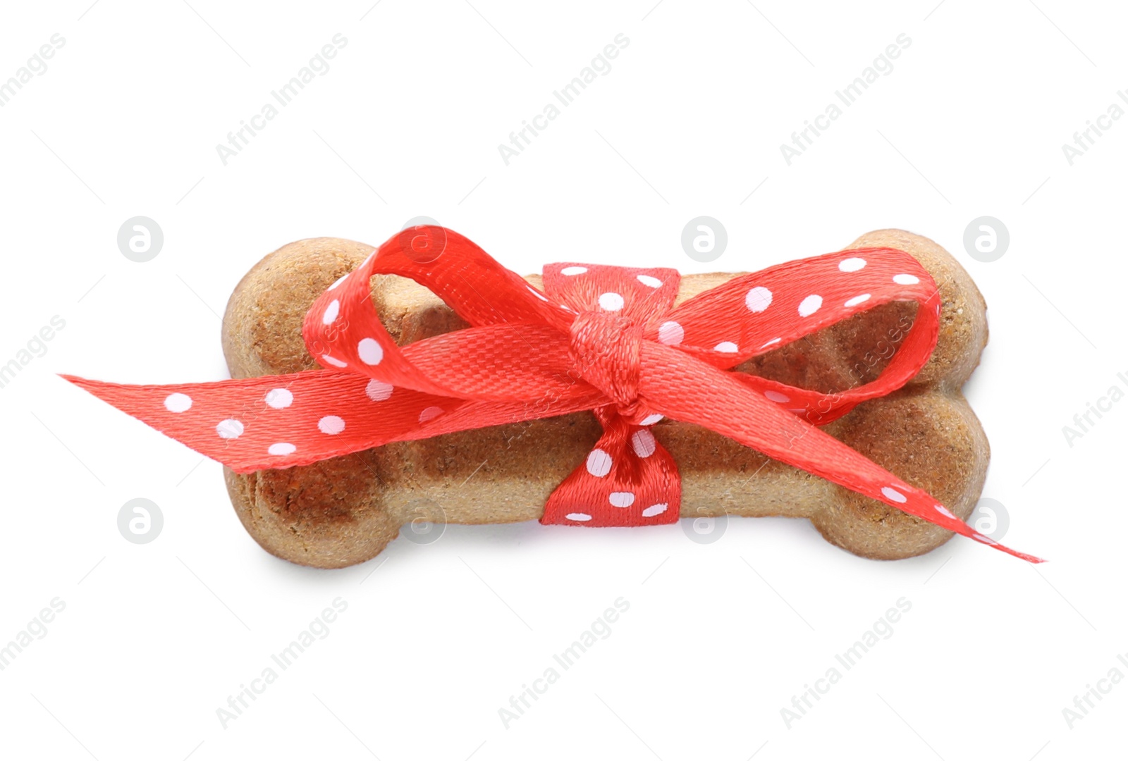 Photo of Bone shaped dog cookie with red bow isolated on white, top view