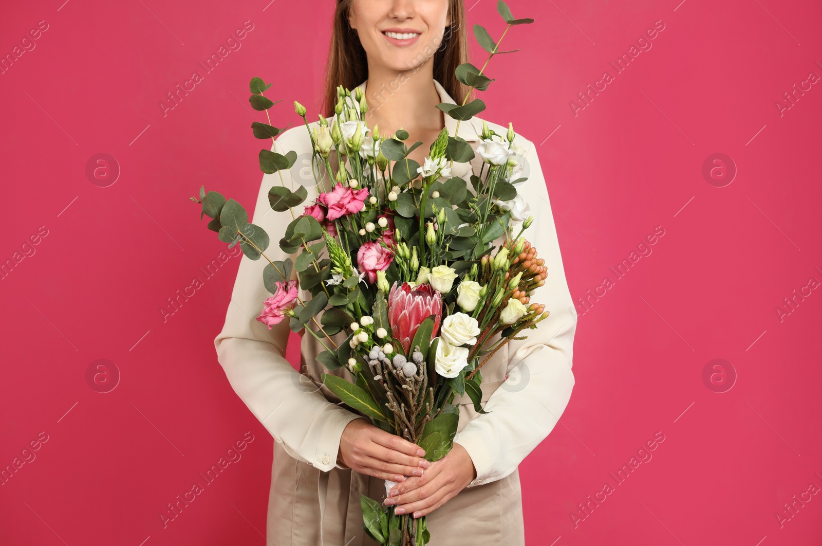 Photo of Florist with beautiful bouquet on pink background, closeup