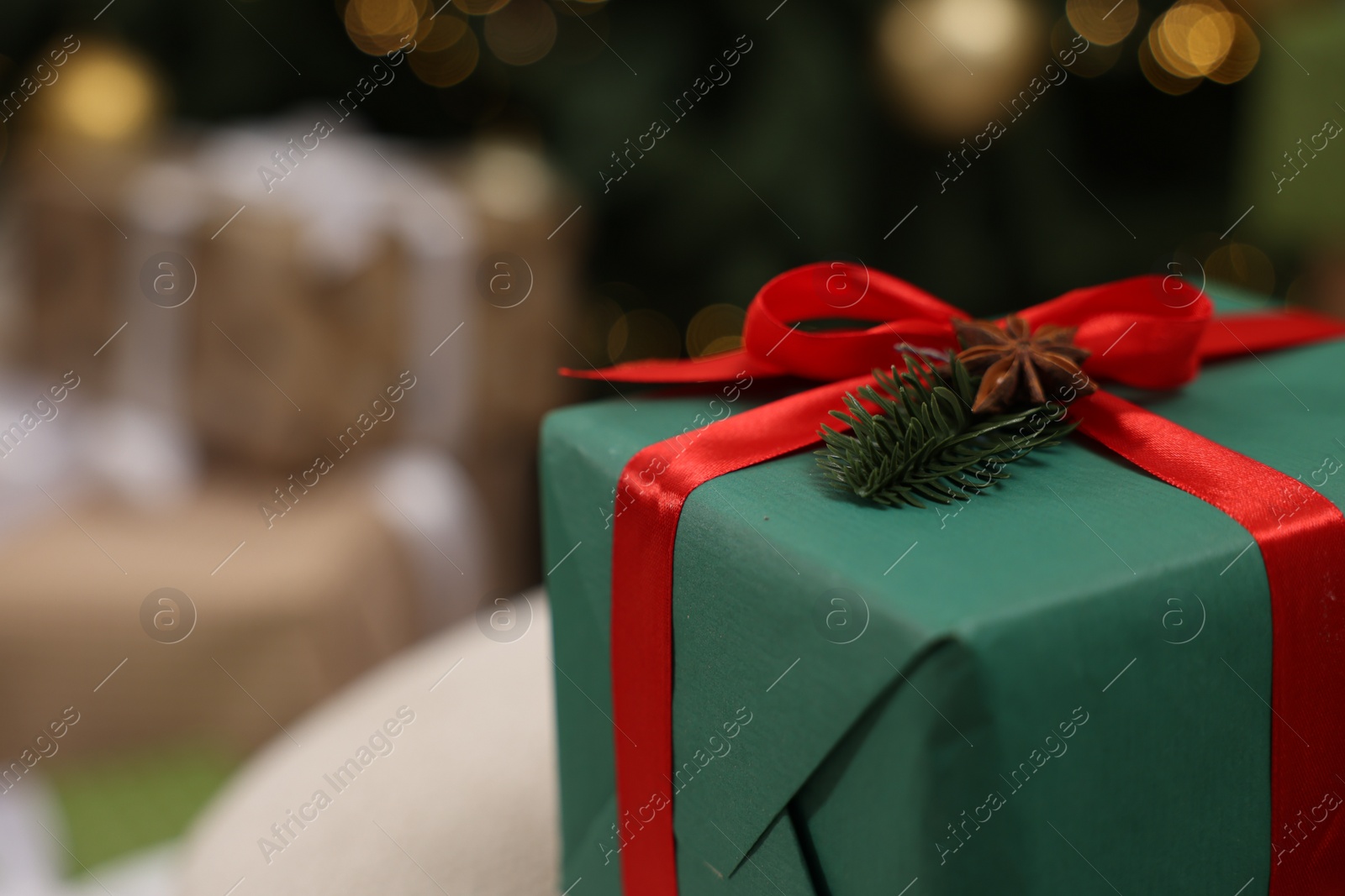 Photo of Christmas present. Gift box in room, closeup. Space for text