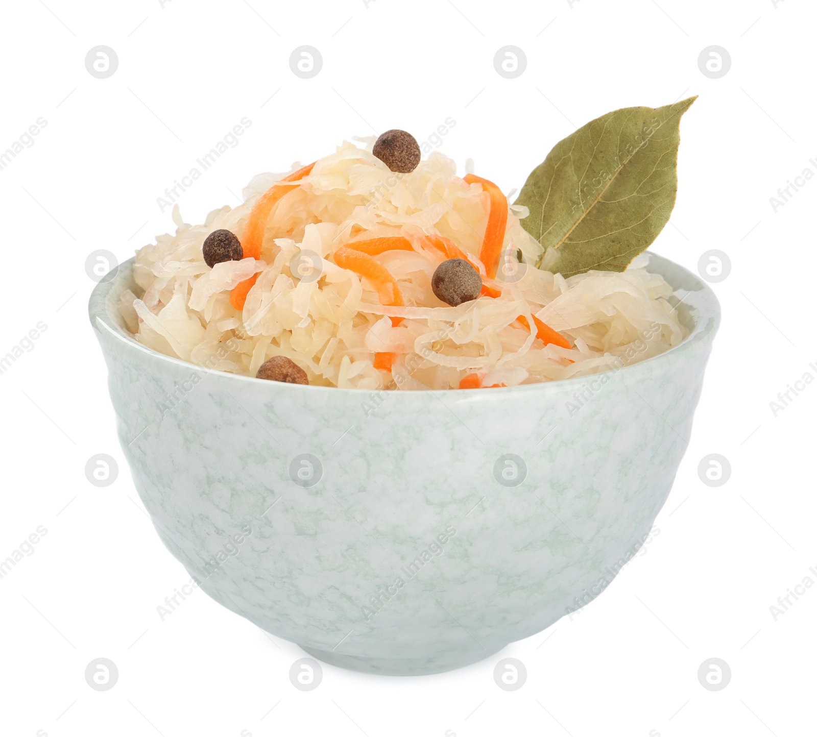 Photo of Bowl of tasty sauerkraut with carrot, peppercorns and bay leaf on white background