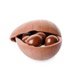 Tasty chocolate egg with candies on white background