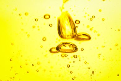 Cooking oil with bubbles as background, closeup