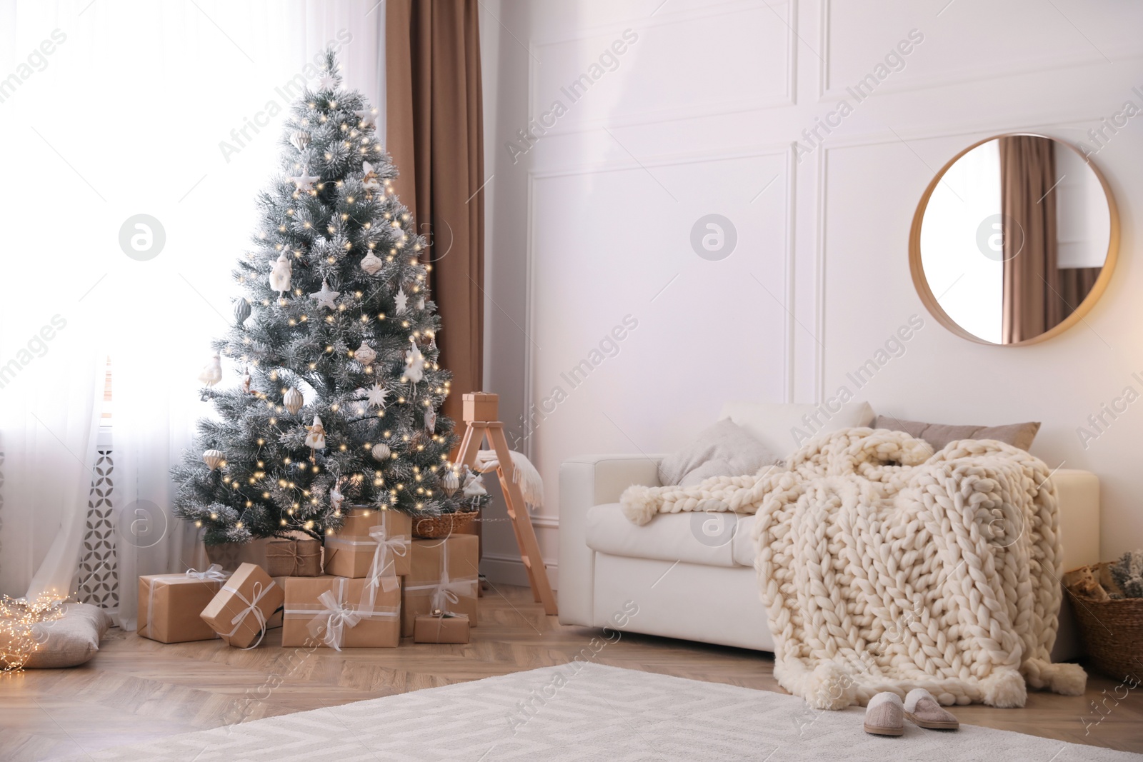 Photo of Beautiful living room interior with decorated Christmas tree and gifts
