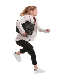 Photo of Beautiful businesswoman with briefcase jumping on white background
