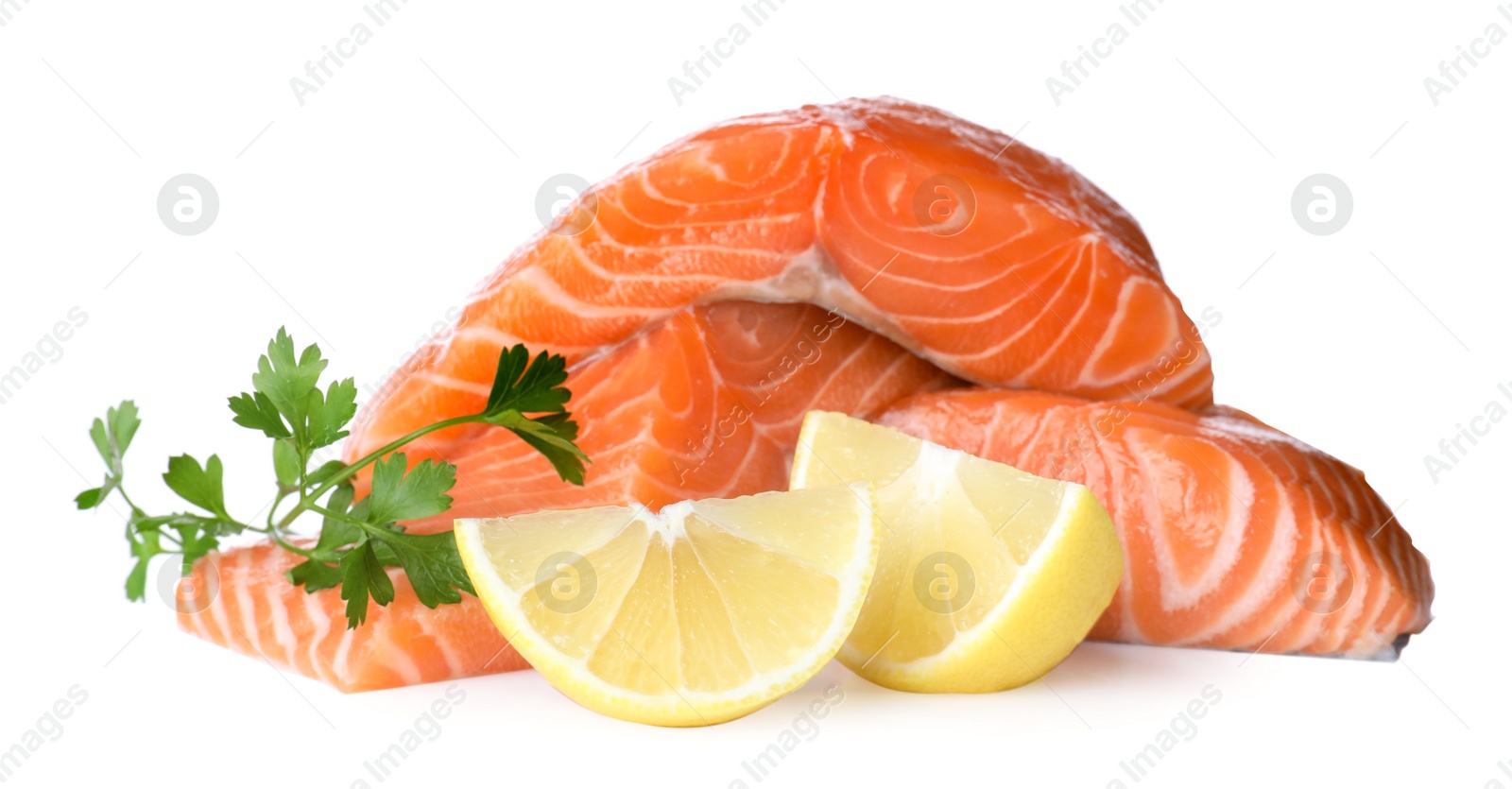 Photo of Fresh raw salmon with parsley and lemon on white background. Fish delicacy