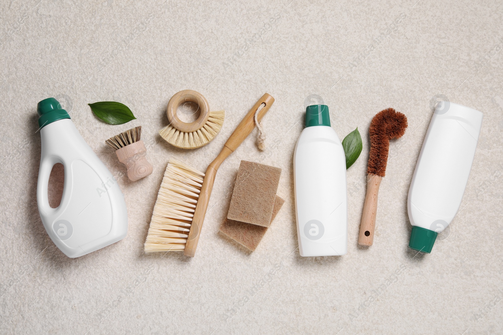 Photo of Flat lay composition with different cleaning supplies on beige background