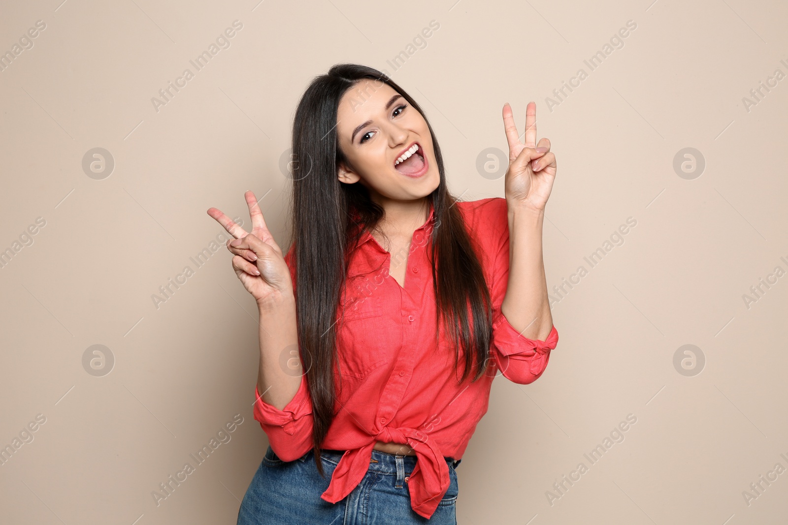 Photo of Portrait of beautiful young woman in stylish clothes on color background