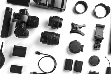 Photo of Composition with camera and video production equipment on white background, top view