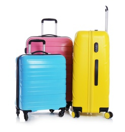 Modern suitcases for travelling on white background