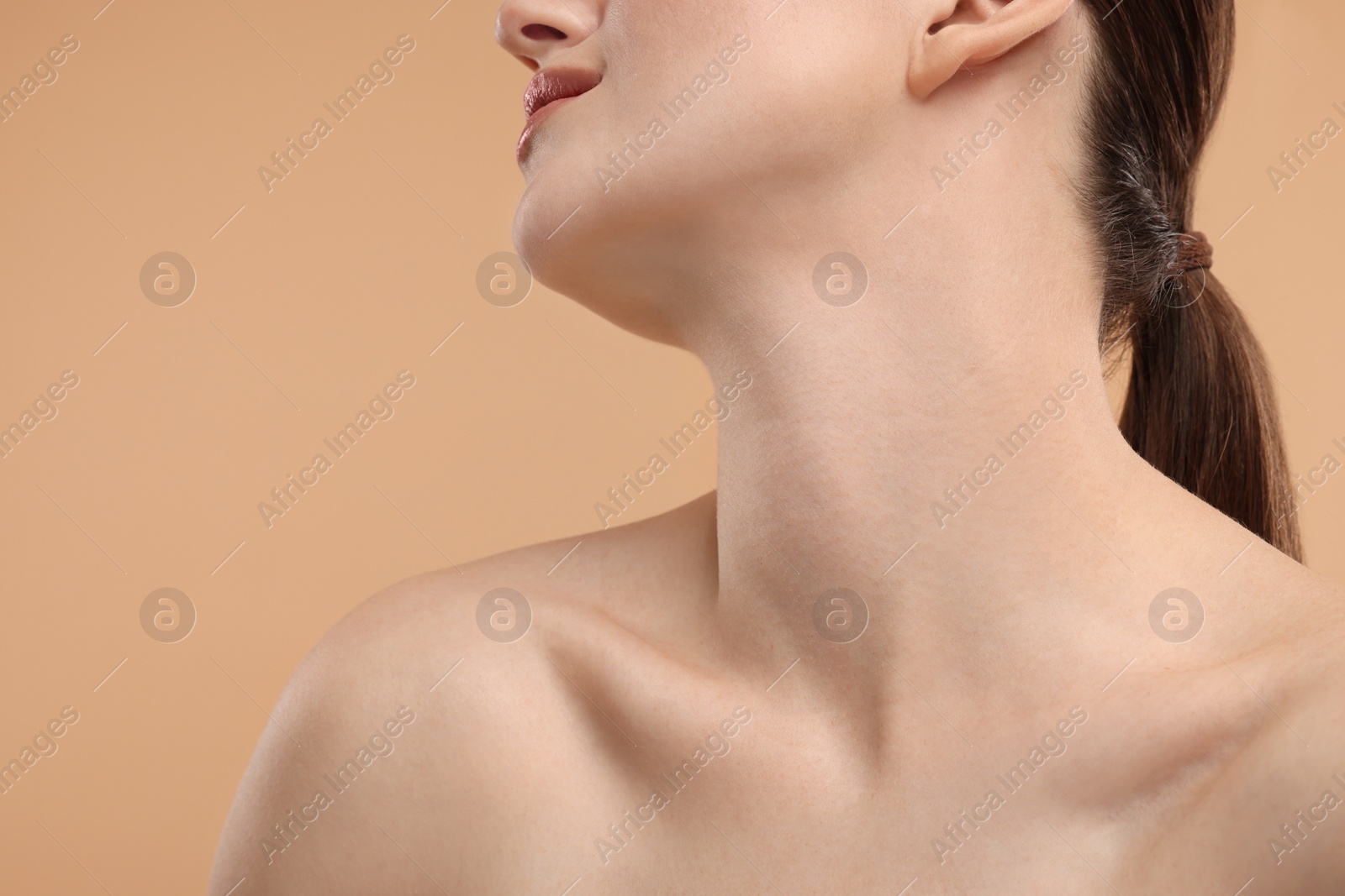 Photo of Beauty concept. Woman on beige background, closeup