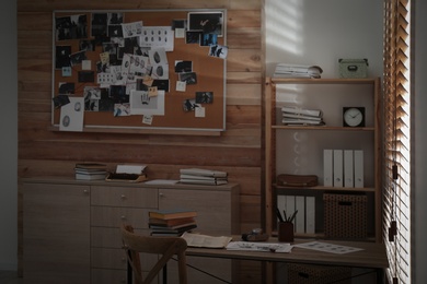 Photo of Detective office interior with evidence board on wall