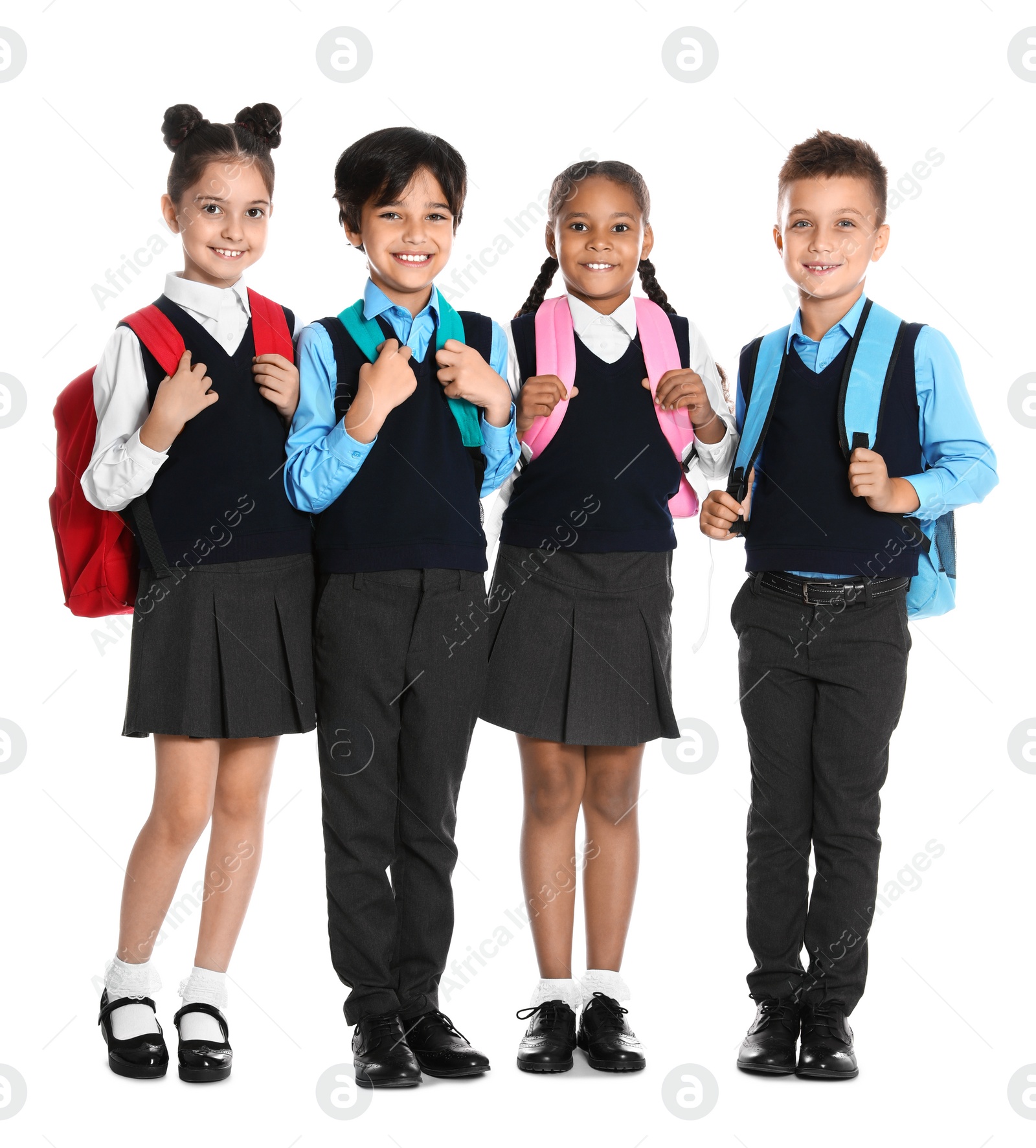 Photo of Happy children in school uniform on white background