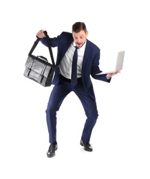 Photo of Full length portrait of businessman with briefcase and laptop balancing on white background