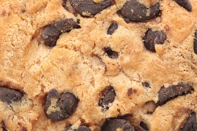 Photo of Texture of tasty chocolate cookie, closeup