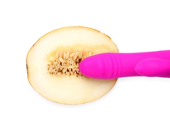 Half of melon and purple vibrator on white background, top view. Sex concept