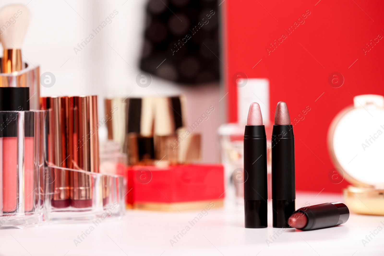 Photo of Different lipsticks on dressing table. Space for text