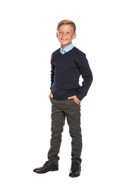 Photo of Little boy in stylish school uniform on white background