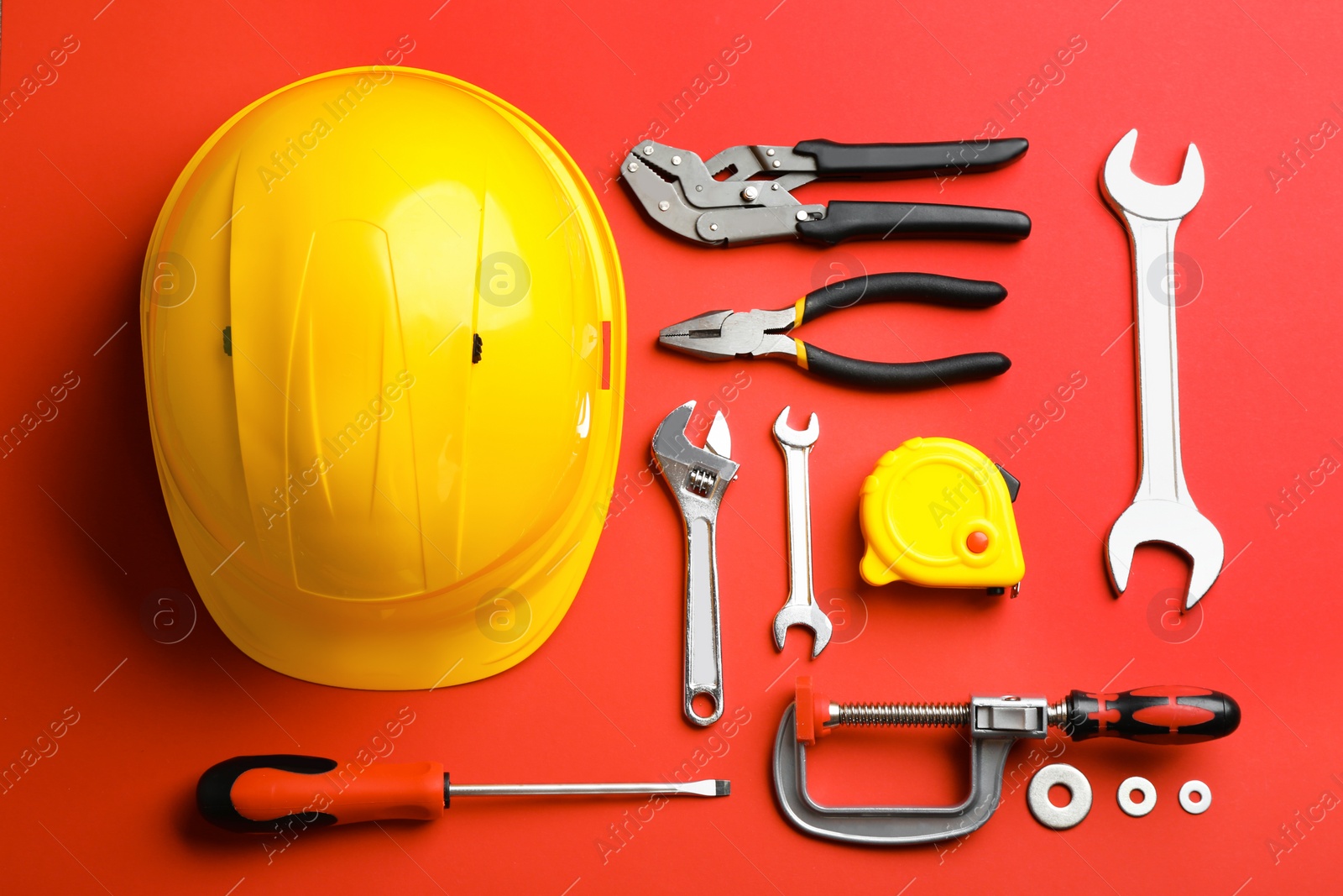 Photo of Flat lay composition with construction tools on color background