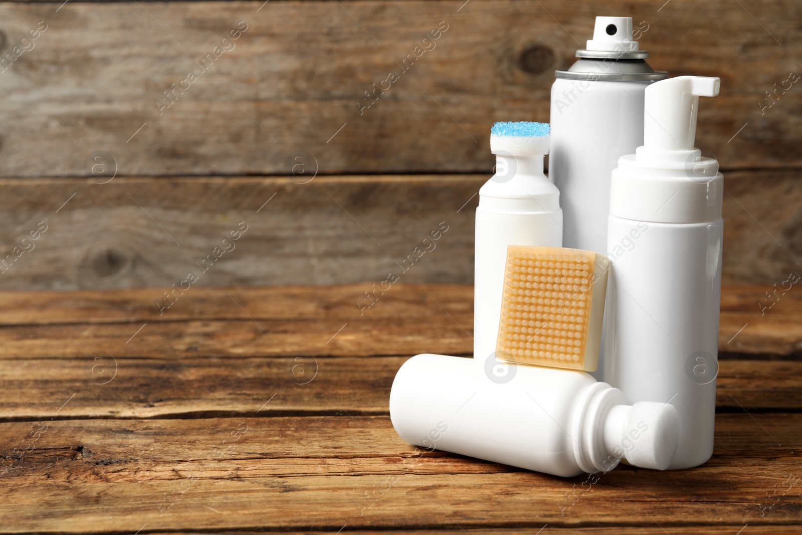 Photo of Composition with shoe care accessories on wooden table. Space for text